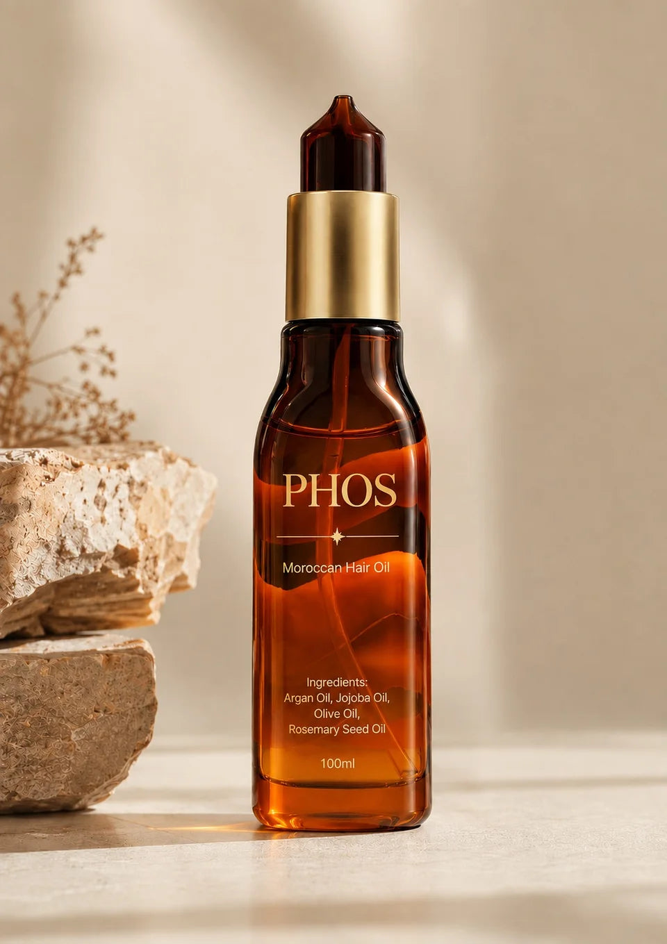 PHOS Moroccan Hair Oil in amber glass and gold